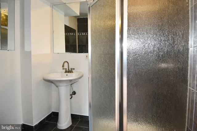 a bathroom with a sink and mirror