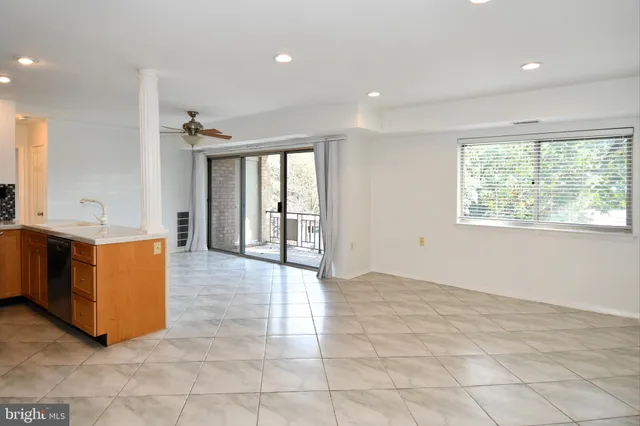 a view of a kitchen with furniture and an entrance