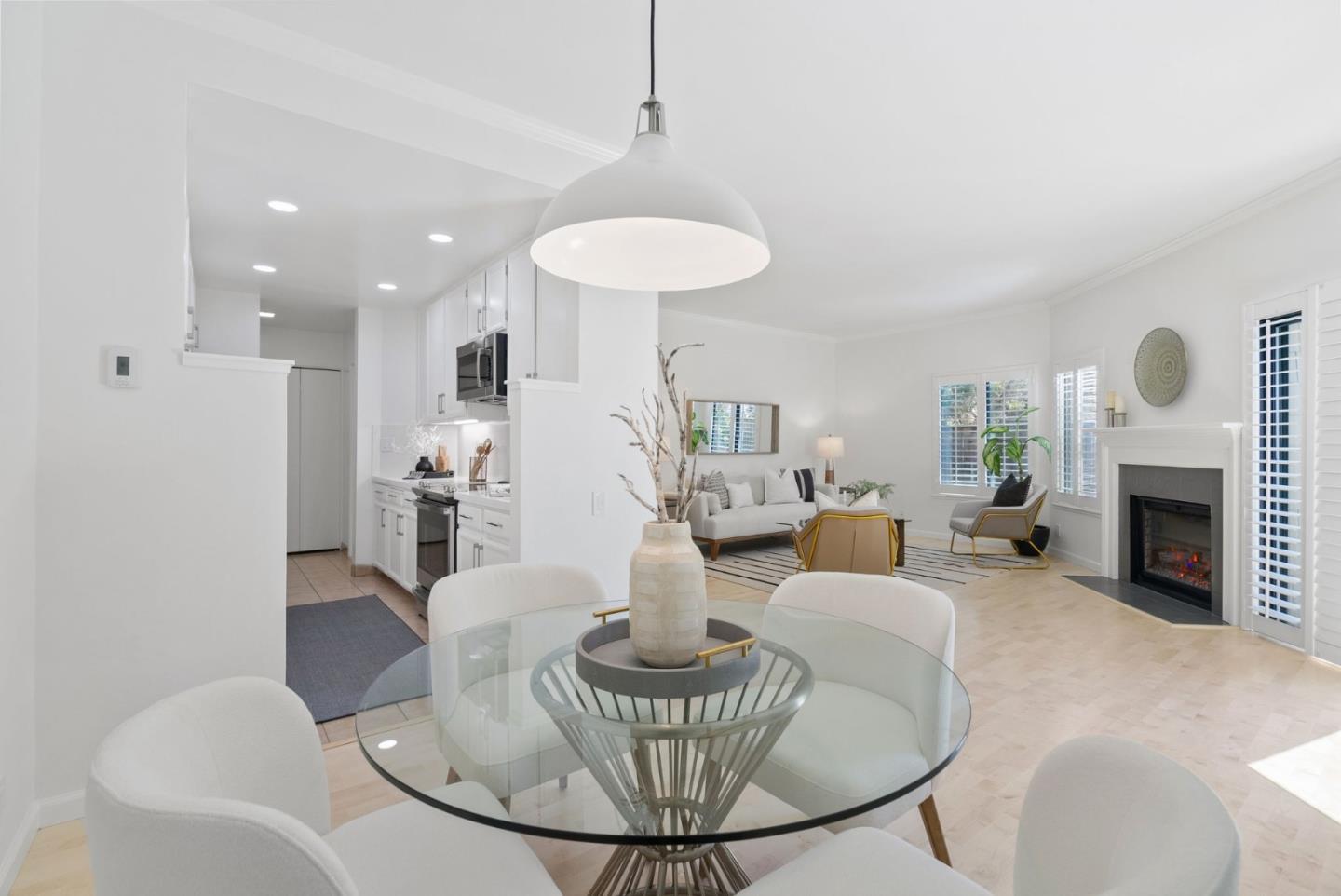 1020 Shoreline Drive San Mateo, CA 94404 - Photo 12 of 46 a living room with furniture a fireplace and a chandelier