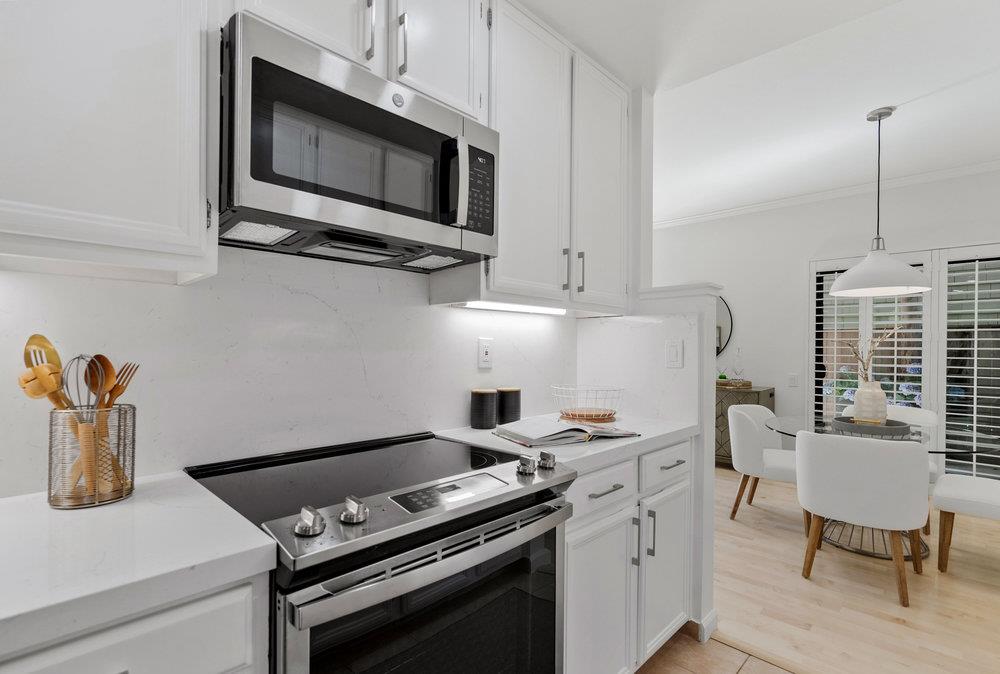 1020 Shoreline Drive San Mateo, CA 94404 - Photo 15 of 46 a kitchen with a stove and a microwave