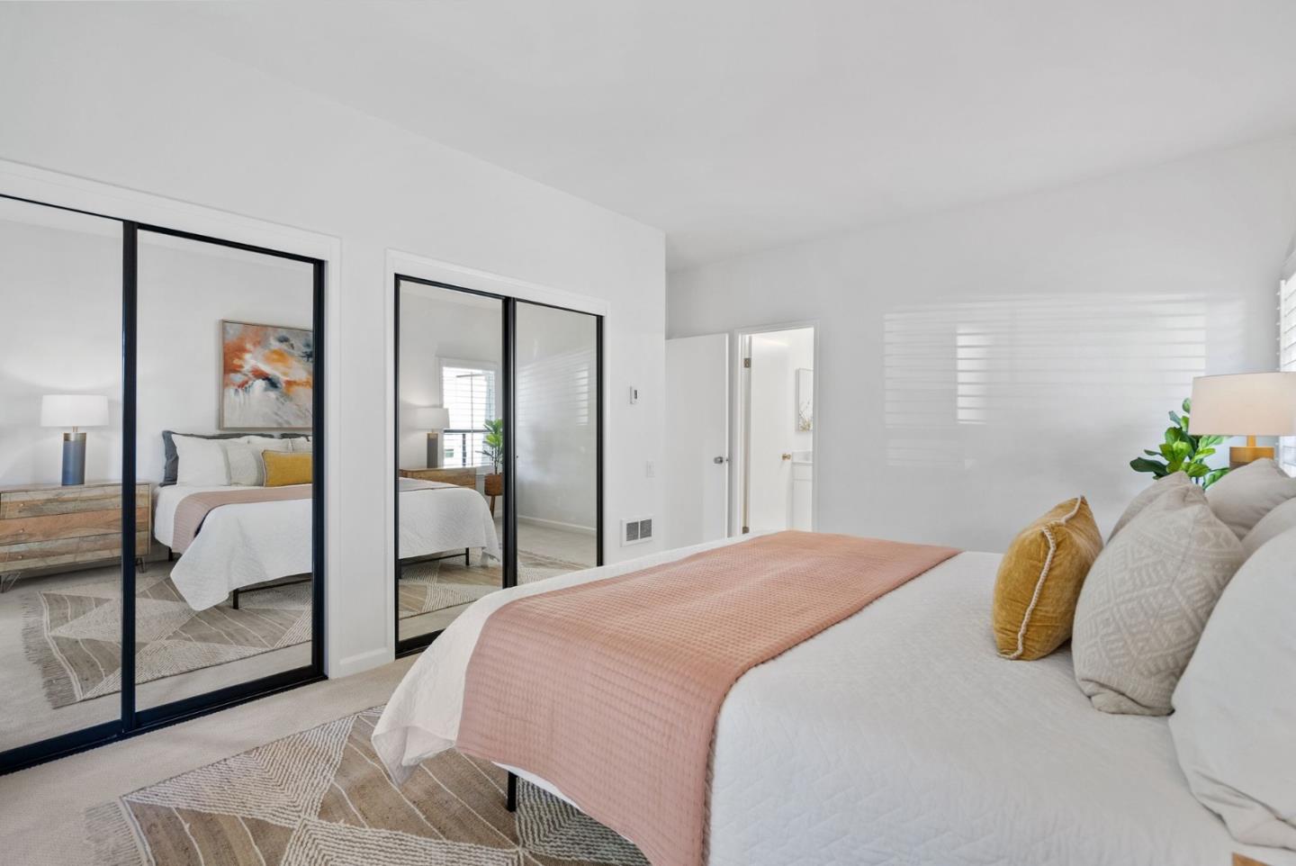 1020 Shoreline Drive San Mateo, CA 94404 - Photo 18 of 46 a bedroom with a bed and a mirror