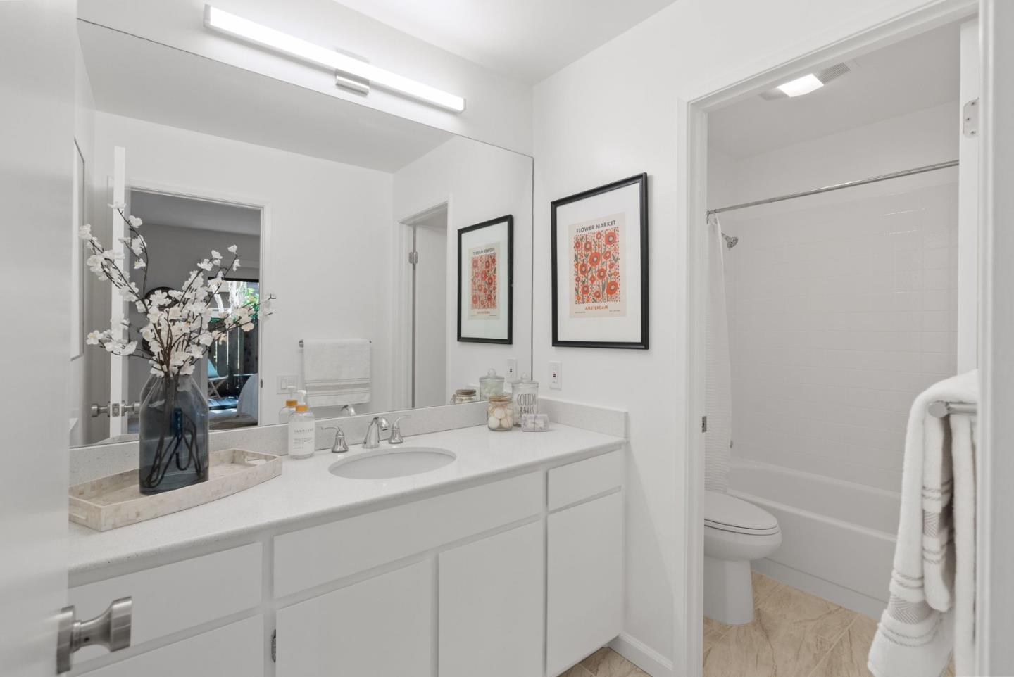 1020 Shoreline Drive San Mateo, CA 94404 - Photo 20 of 46 a bathroom with a sink a toilet and shower