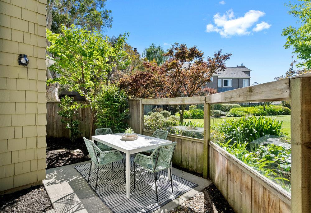 1020 Shoreline Drive San Mateo, CA 94404 - Photo 26 of 46 a view of a patio with table and chairs and potted plants