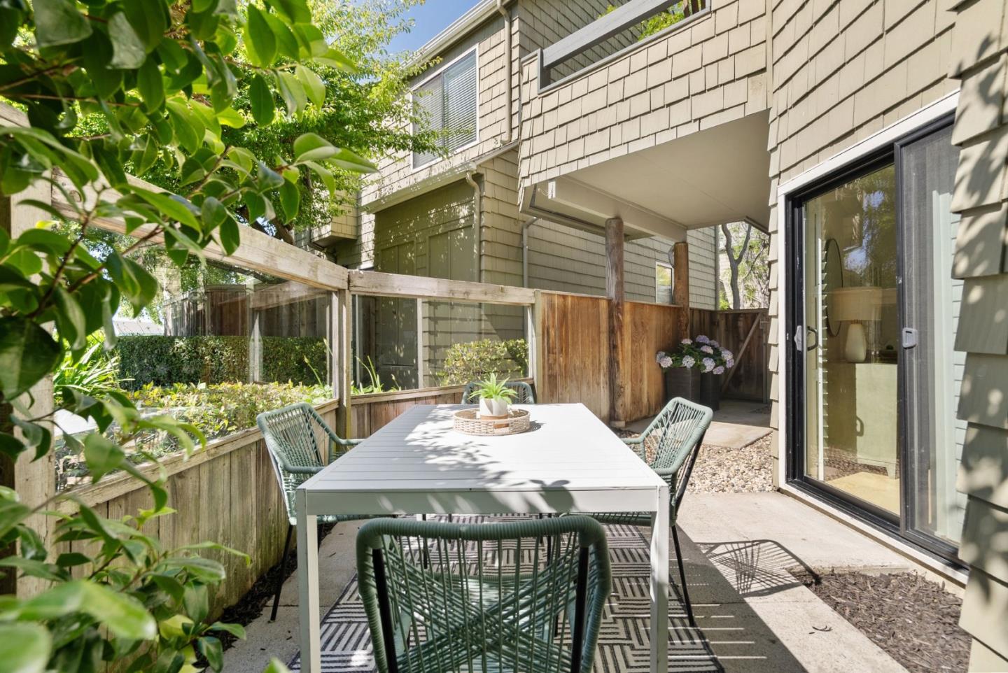 1020 Shoreline Drive San Mateo, CA 94404 - Photo 27 of 46 a view of a patio with a table and chairs