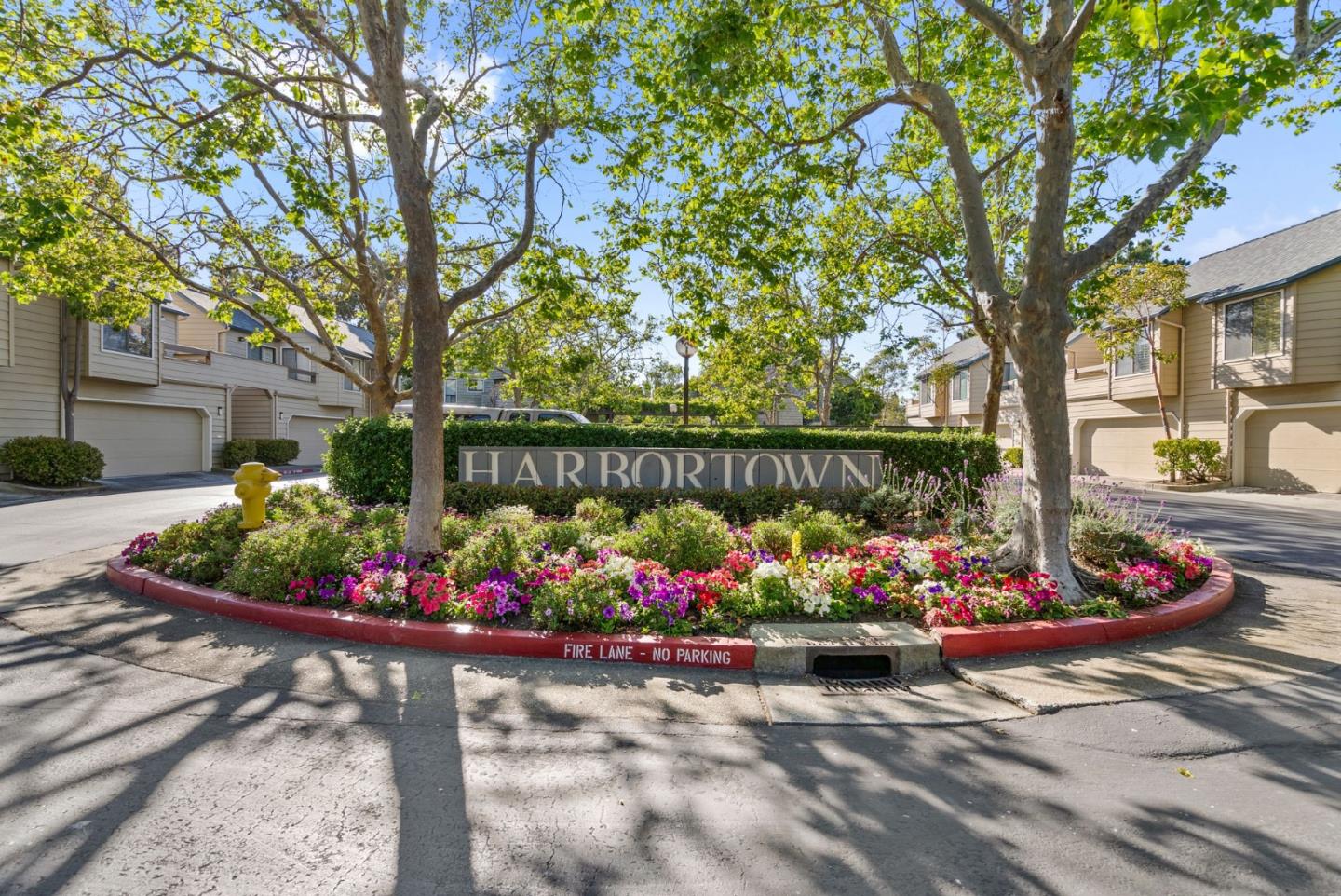 1020 Shoreline Drive San Mateo, CA 94404 - Photo 33 of 46 a street view with flowers garden and wooden fence