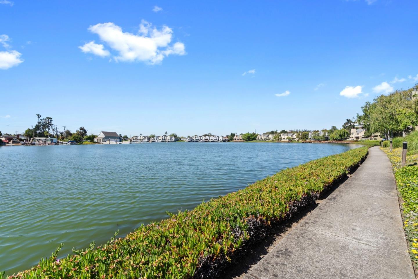 1020 Shoreline Drive San Mateo, CA 94404 - Photo 34 of 46 a view of a lake with a big yard