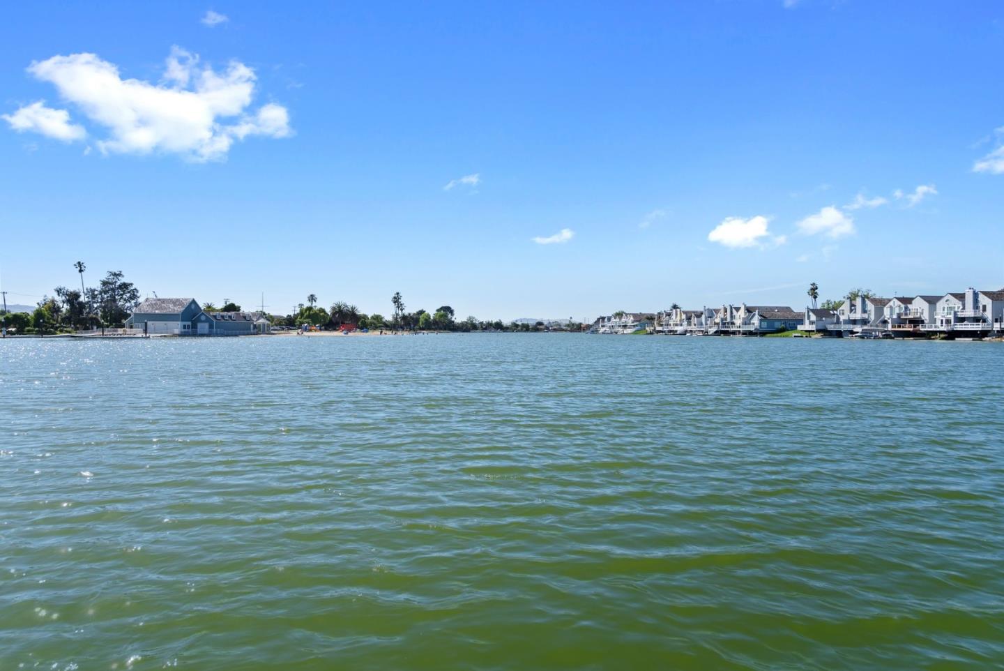 1020 Shoreline Drive San Mateo, CA 94404 - Photo 38 of 46 a view of a lake with sunset in background