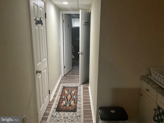 a view of a bathroom from the hallway