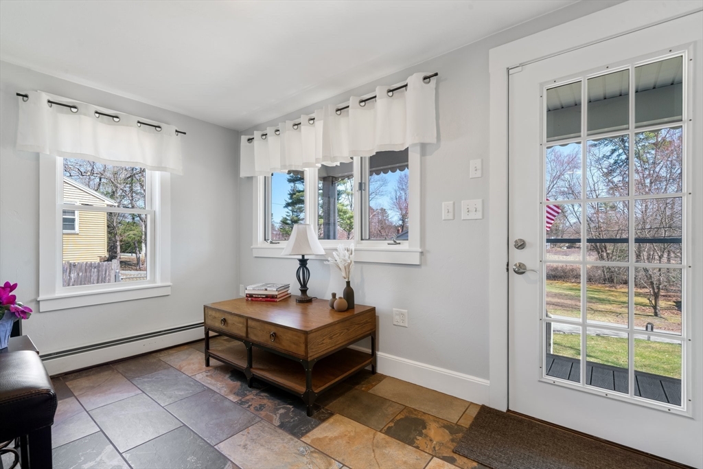 9 Riverside Road Billerica, MA 01821 - Photo 13 of 42 a living room with furniture and a window