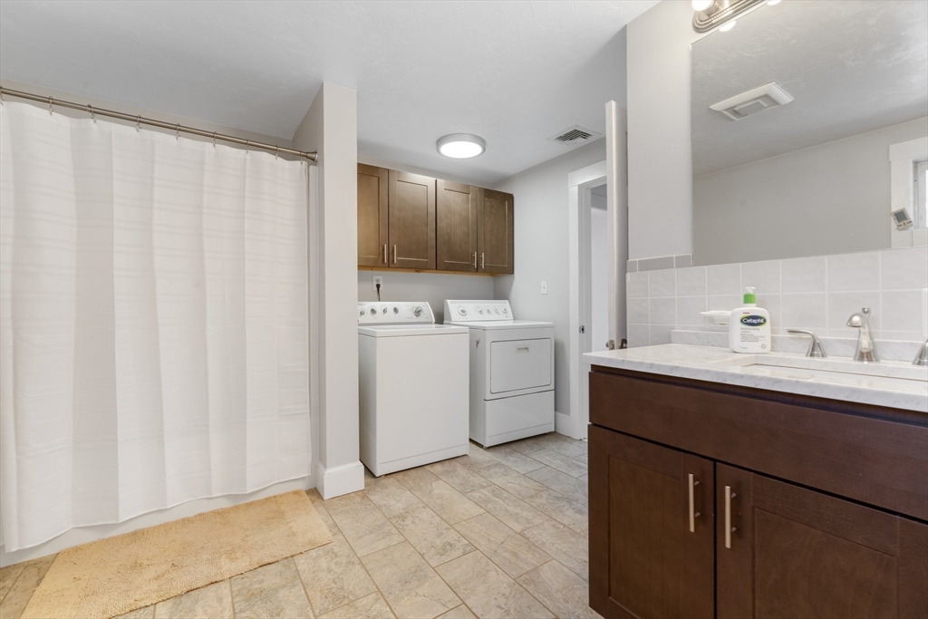 9 Riverside Road Billerica, MA 01821 - Photo 20 of 42 a kitchen with a sink cabinets and window