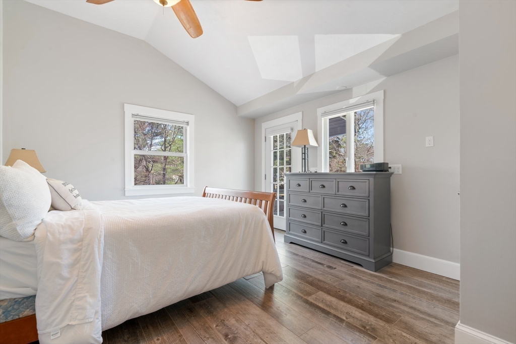 9 Riverside Road Billerica, MA 01821 - Photo 22 of 42 a bedroom with a bed and a dresser