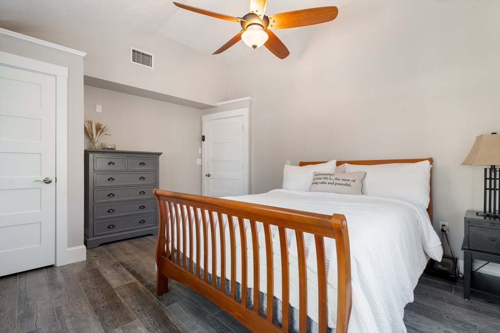 9 Riverside Road Billerica, MA 01821 - Photo 23 of 42 a bedroom with a bed and a dresser