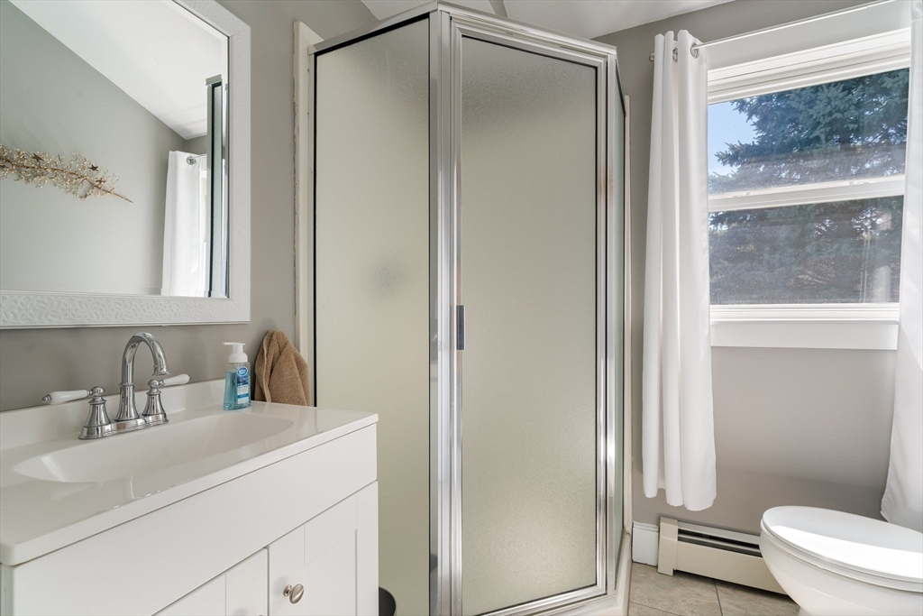 9 Riverside Road Billerica, MA 01821 - Photo 28 of 42 a bathroom with a sink toilet and shower