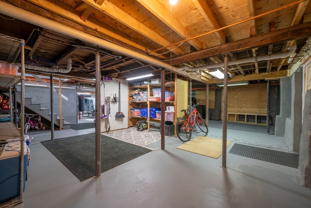 9 Riverside Road Billerica, MA 01821 - Photo 31 of 42 a view of a garage with a white car parked