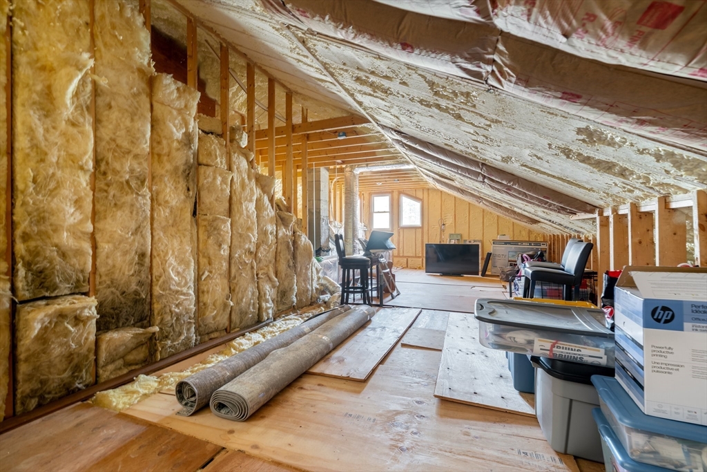 9 Riverside Road Billerica, MA 01821 - Photo 32 of 42 a living room with furniture and a floor to ceiling window