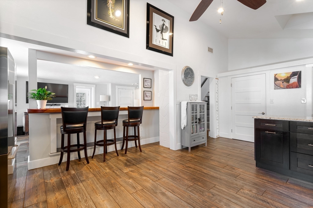 9 Riverside Road Billerica, MA 01821 - Photo 9 of 42 a view of a dining area with furniture and wooden floor