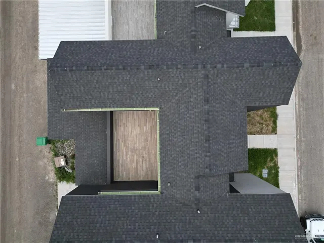 a aerial view of a house with a yard