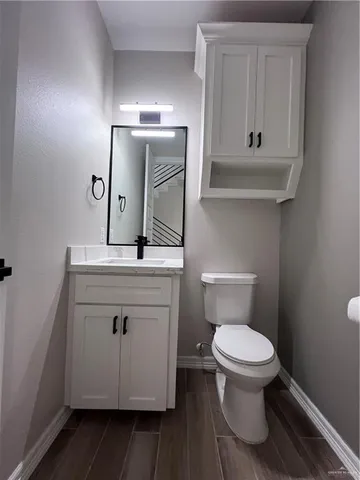 a kitchen with stove a sink and refrigerator