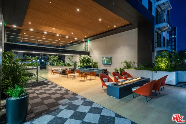 a outdoor space with lots of furniture and plants