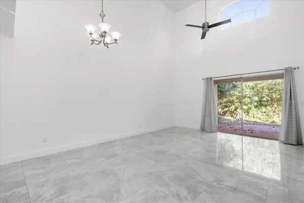 en empty room with windows and outdoor view
