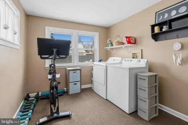 a view of kitchen and workspace with furniture