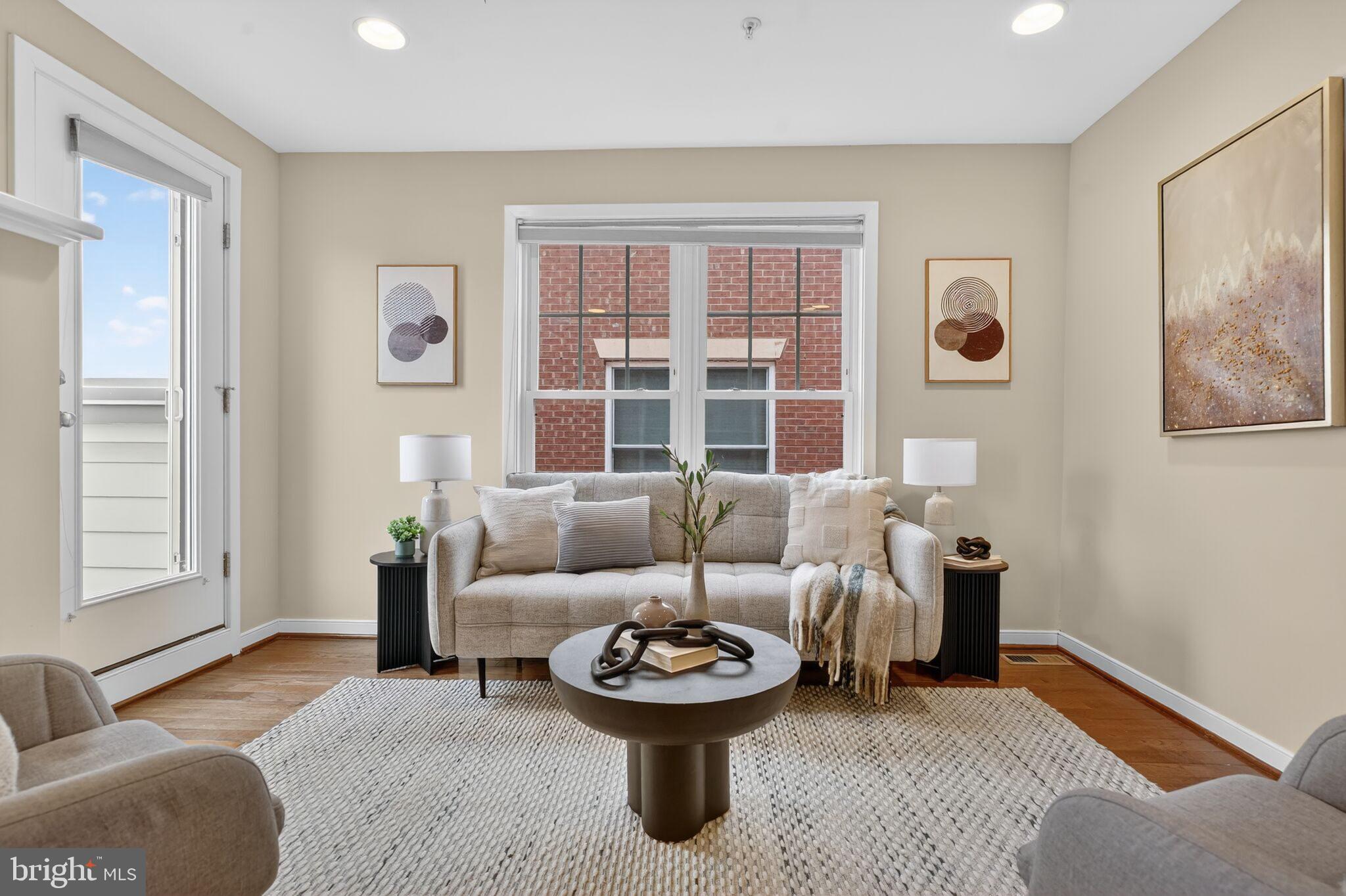 2909 Chancellor's Way Northeast Washington, DC 20017 - Photo 12 of 31 a living room with furniture and windows