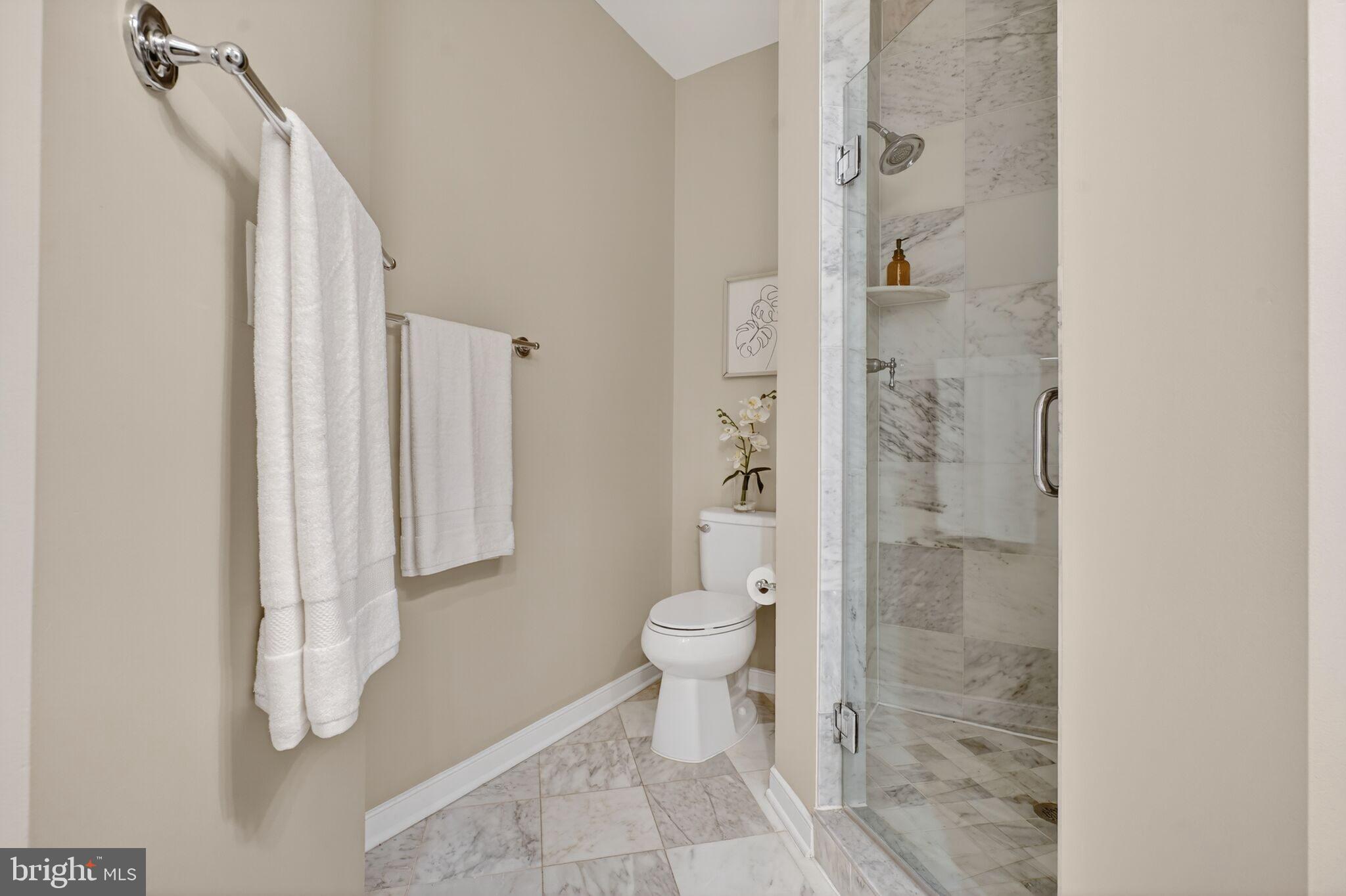 2909 Chancellor's Way Northeast Washington, DC 20017 - Photo 17 of 31 a bathroom with a toilet and a shower