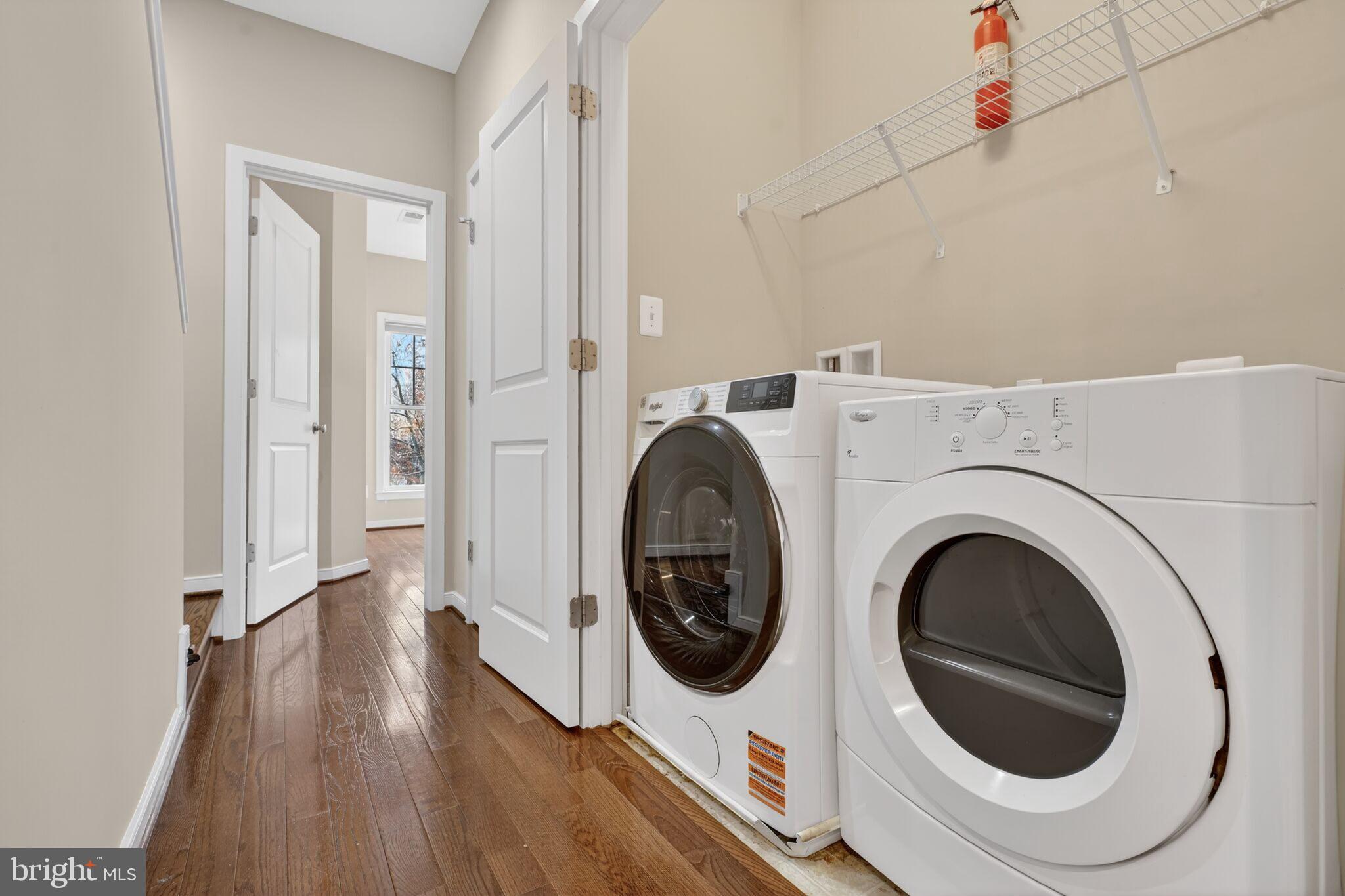 2909 Chancellor's Way Northeast Washington, DC 20017 - Photo 20 of 31 a view of a hallway with washer and dryer