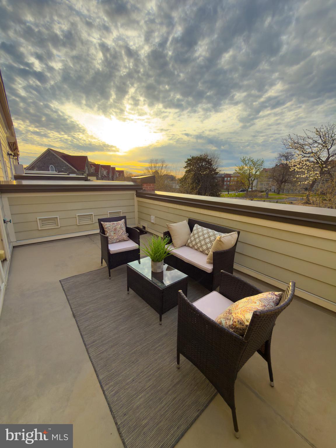 2909 Chancellor's Way Northeast Washington, DC 20017 - Photo 25 of 31 a view of a terrace with couches and a potted plant on a table