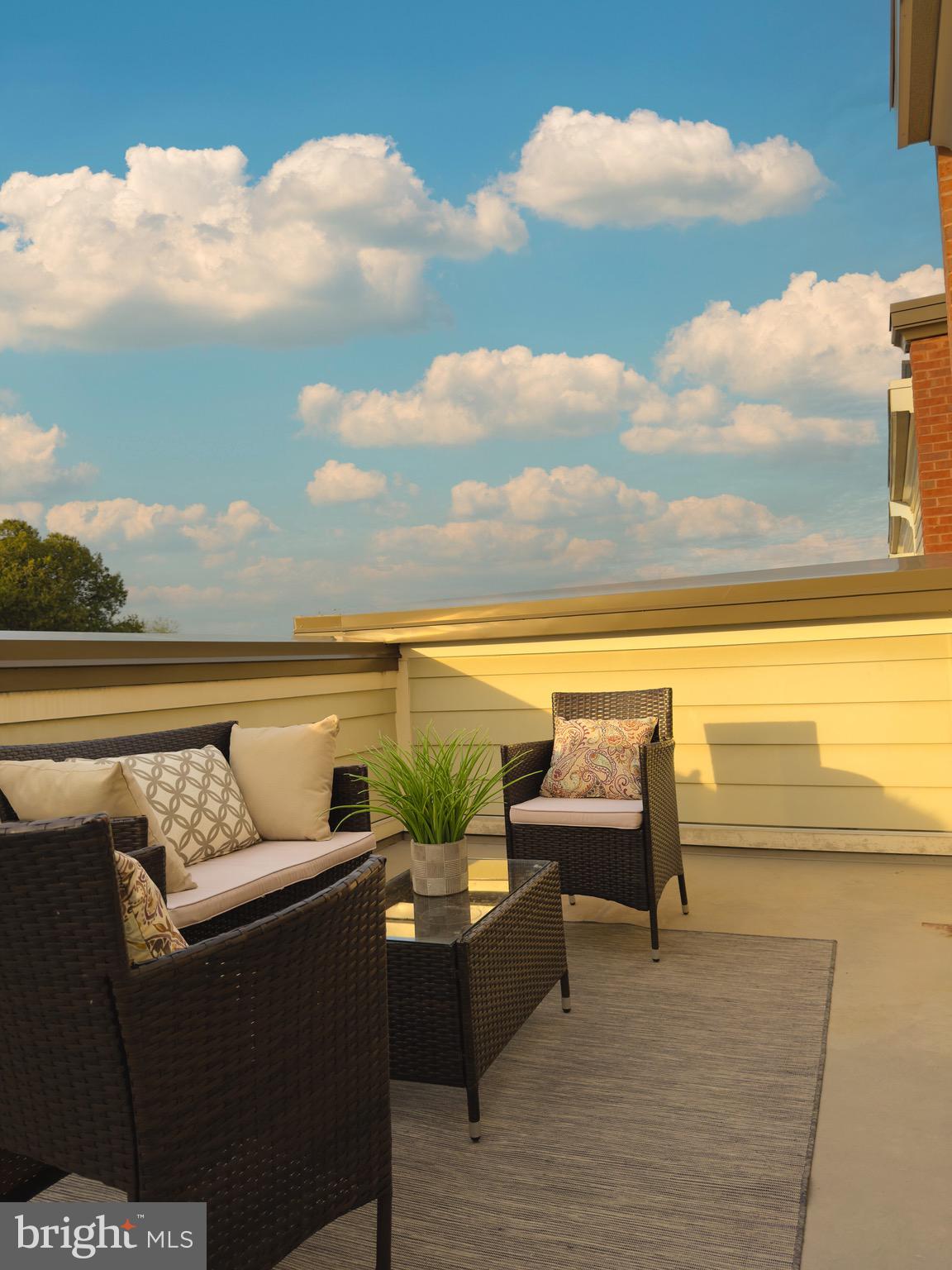 2909 Chancellor's Way Northeast Washington, DC 20017 - Photo 27 of 31 a balcony with furniture and city view