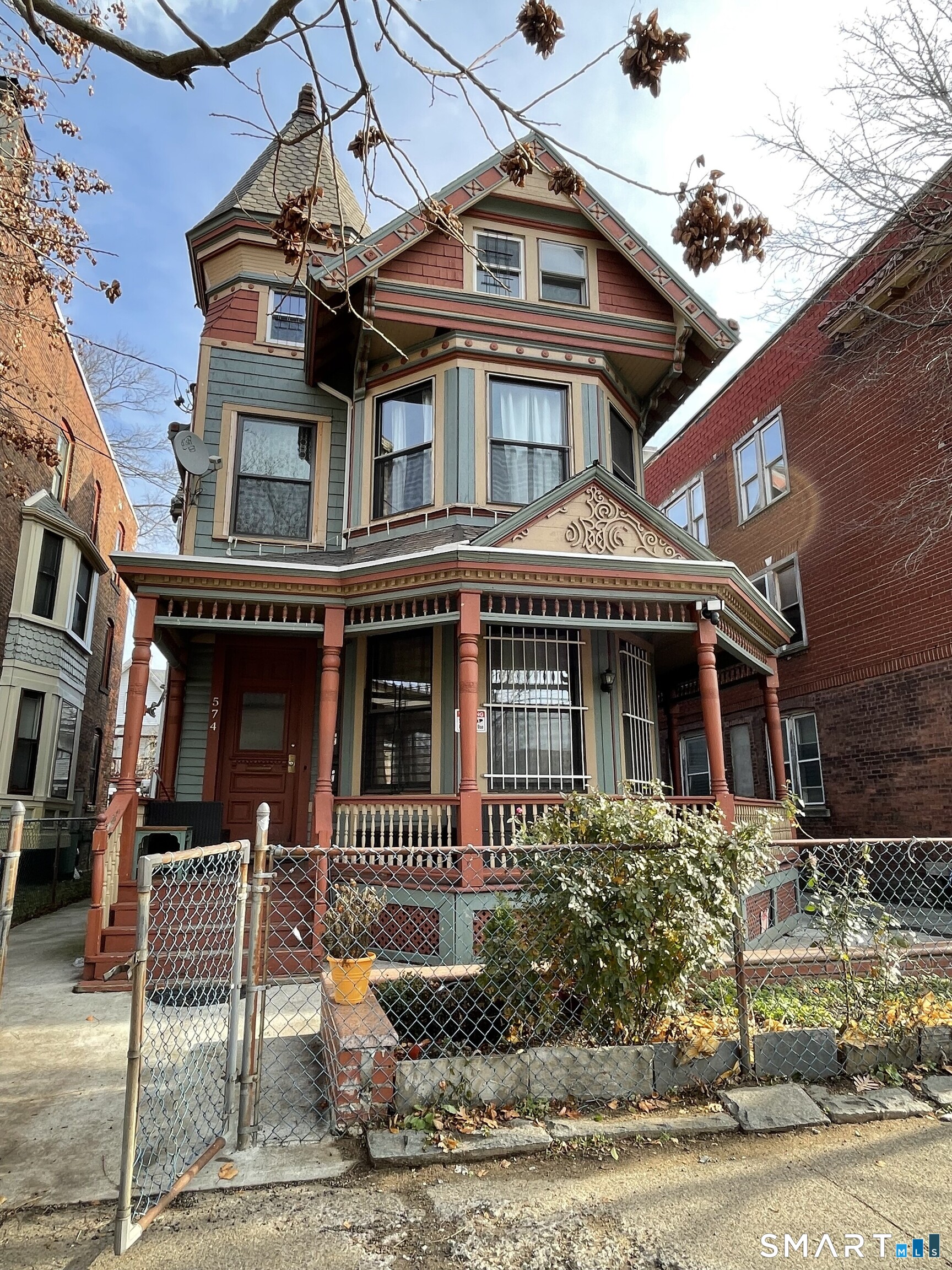Undisclosed Address Bridgeport, CT 06608 - Photo 1 of 10 front view of a house