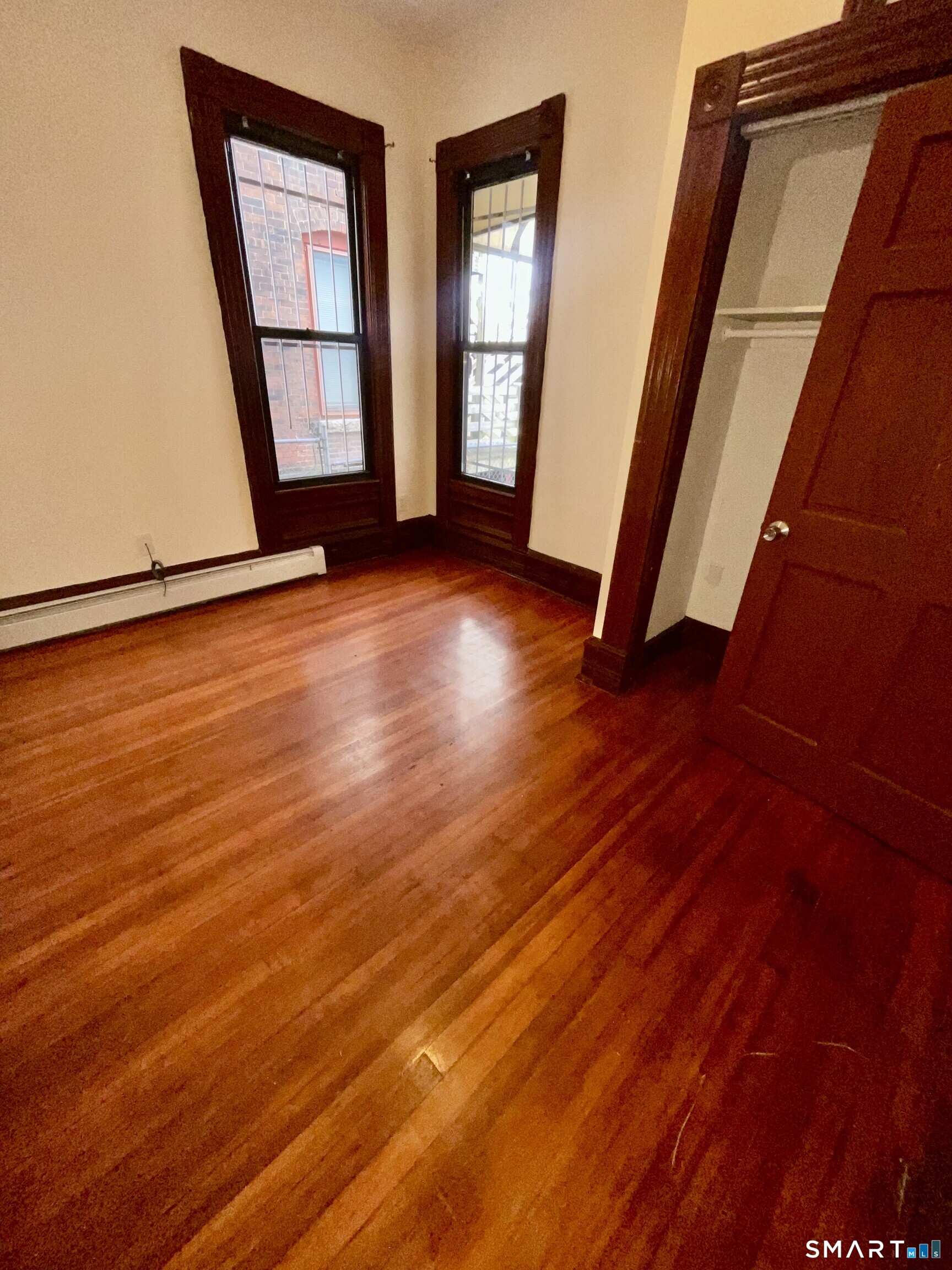 Undisclosed Address Bridgeport, CT 06608 - Photo 2 of 10 wooden floor in an empty room