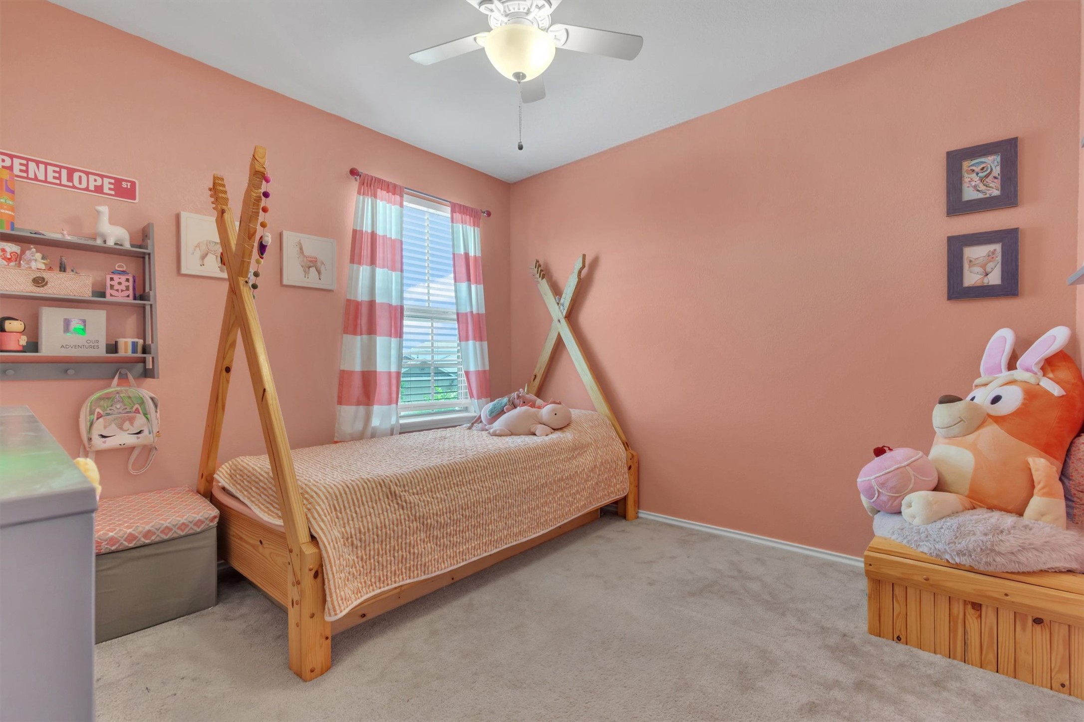 11701 Jackson Falls Way Manor, TX 78653 - Photo 21 of 40 A well-lit bedroom features plush carpeting and a decorative ceiling fan.