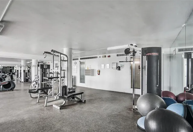a view of a lake with couches chairs and swimming pool with a yard