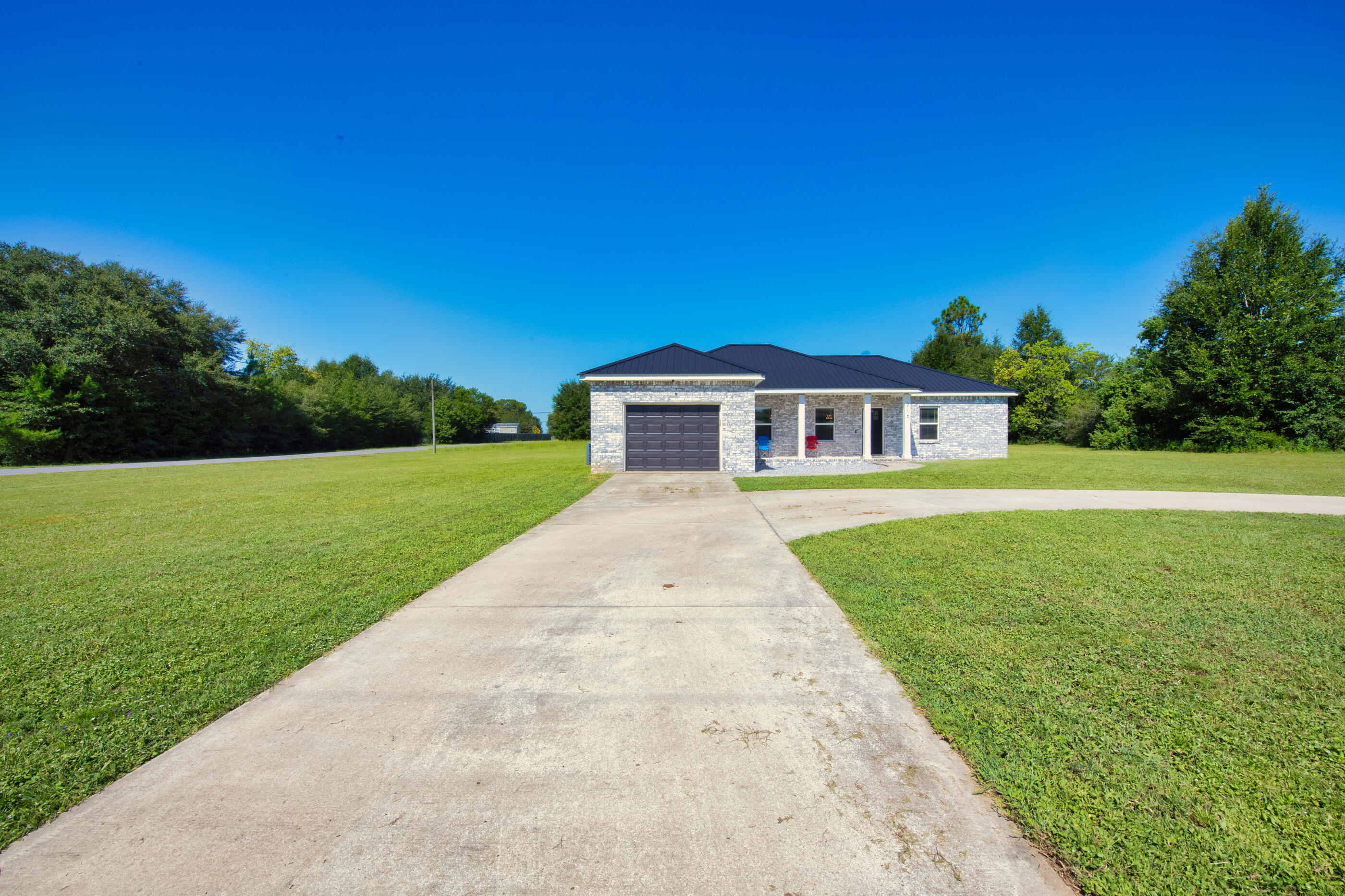 6116 Robin Road Crestview, FL 32539 - Photo 1 of 24 a view of house with a big yard