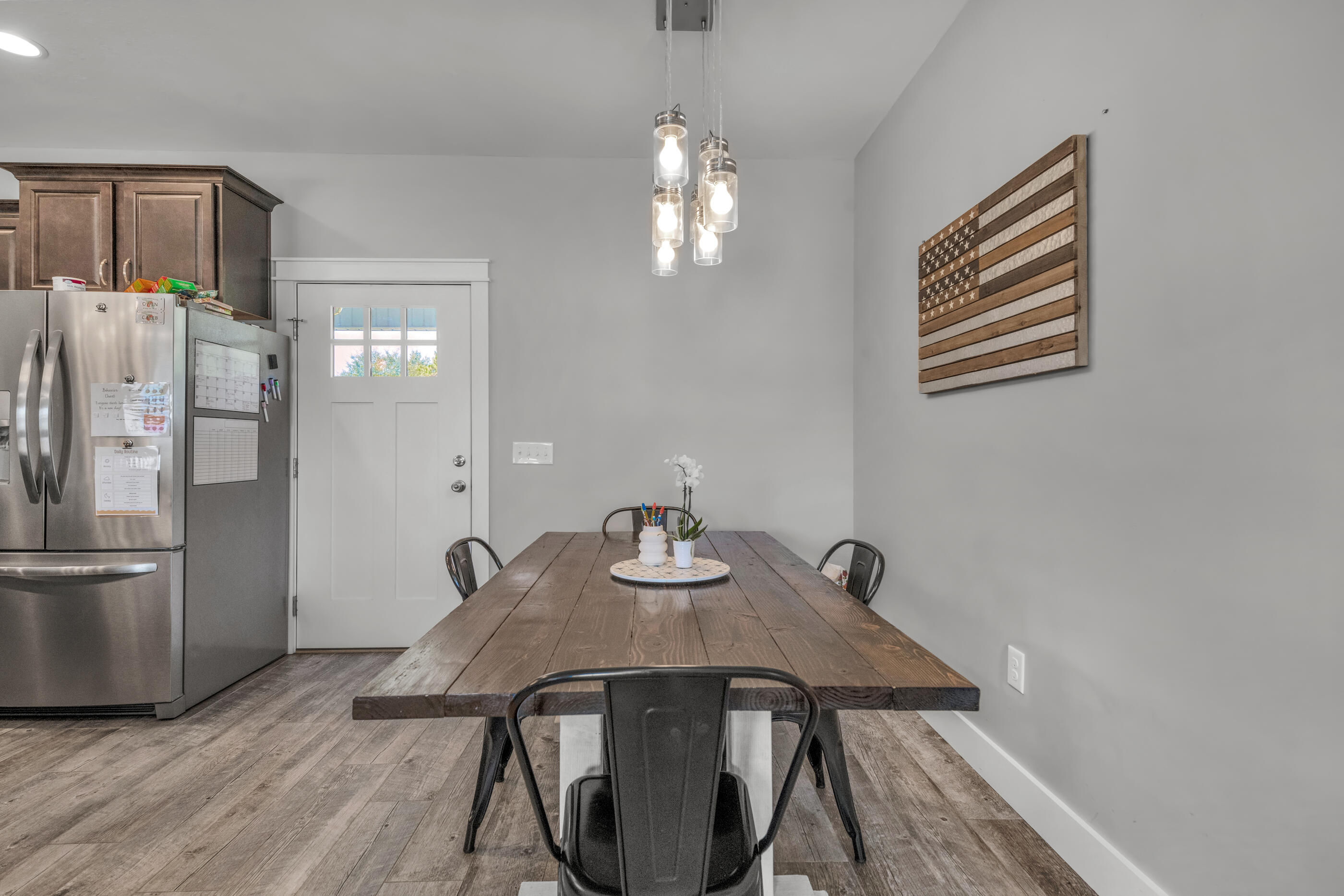 6116 Robin Road Crestview, FL 32539 - Photo 12 of 24 a view of a dining room with furniture and wooden floor