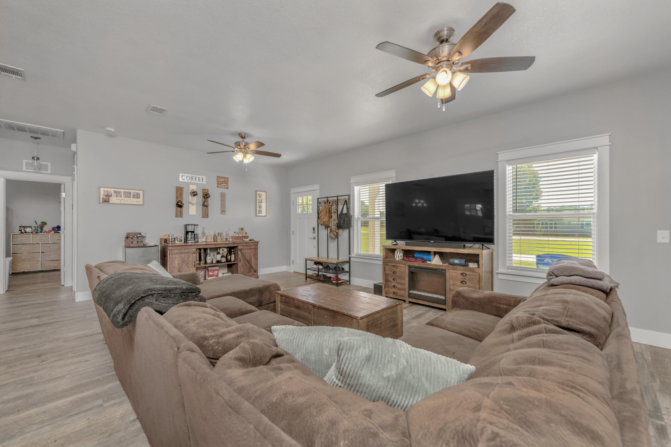 6116 Robin Road Crestview, FL 32539 - Photo 14 of 24 a living room with furniture and a flat screen tv