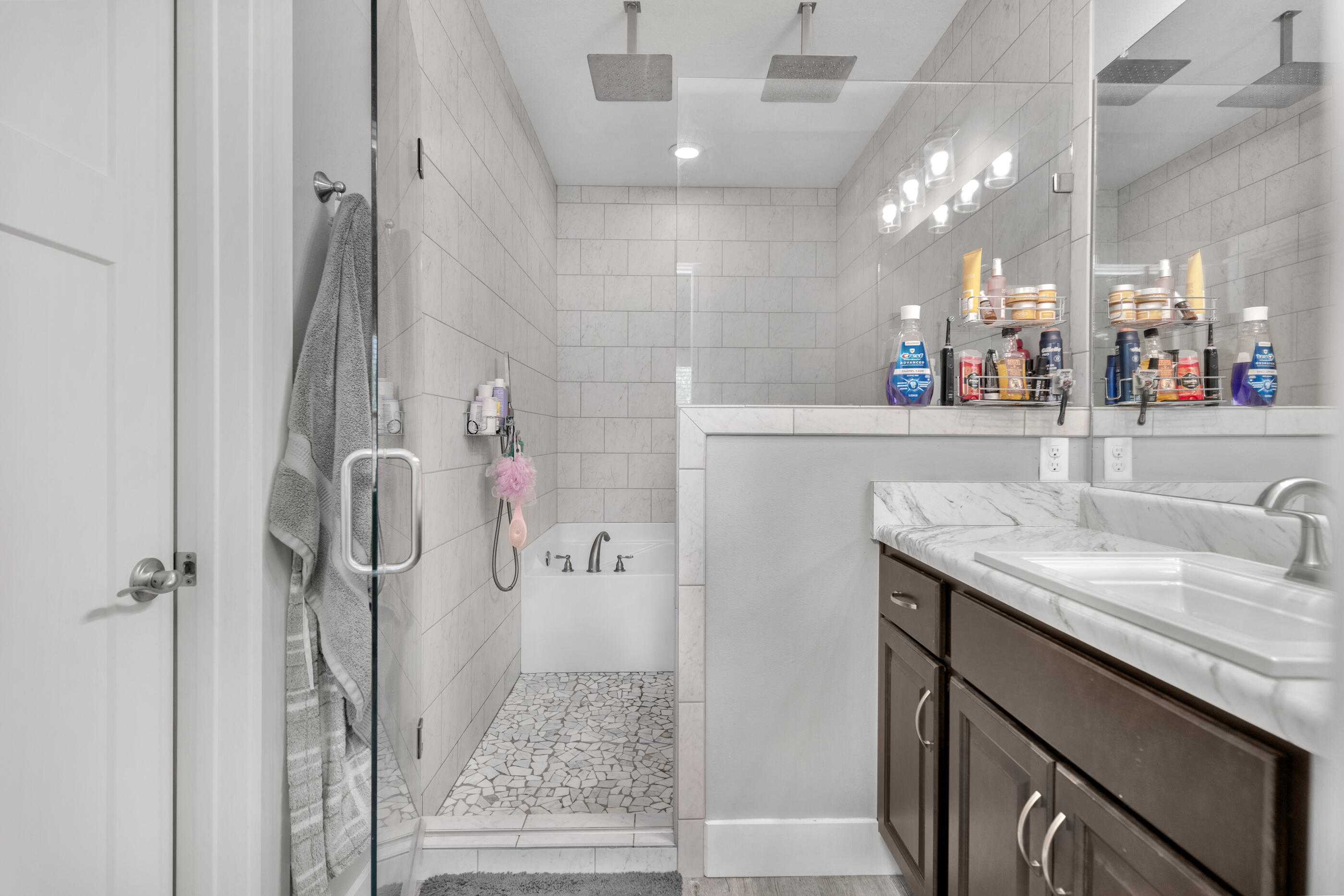 6116 Robin Road Crestview, FL 32539 - Photo 17 of 24 a bathroom with a granite countertop sink a mirror and shower