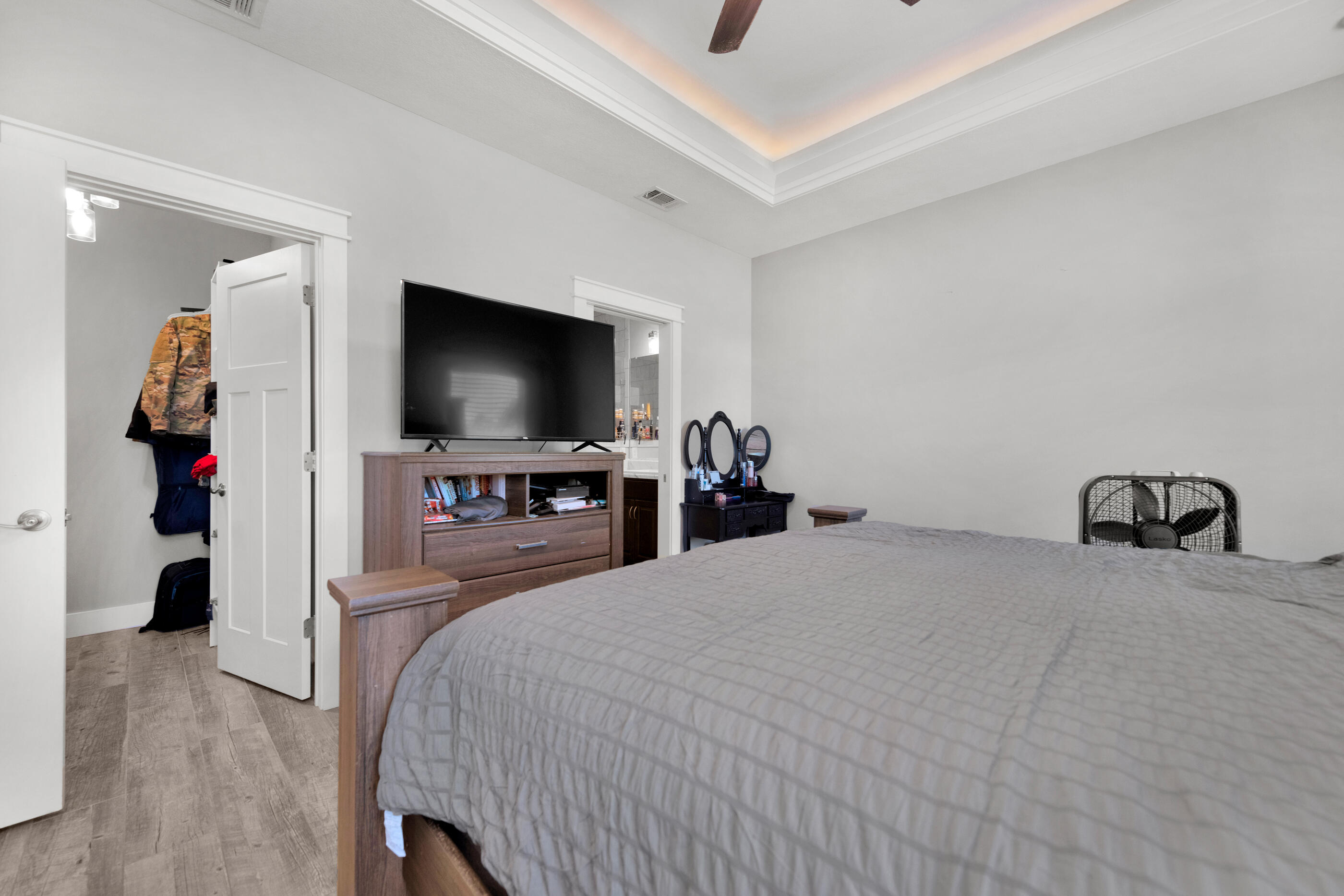 6116 Robin Road Crestview, FL 32539 - Photo 18 of 24 a bedroom with a bed and a flat tv screen on wall