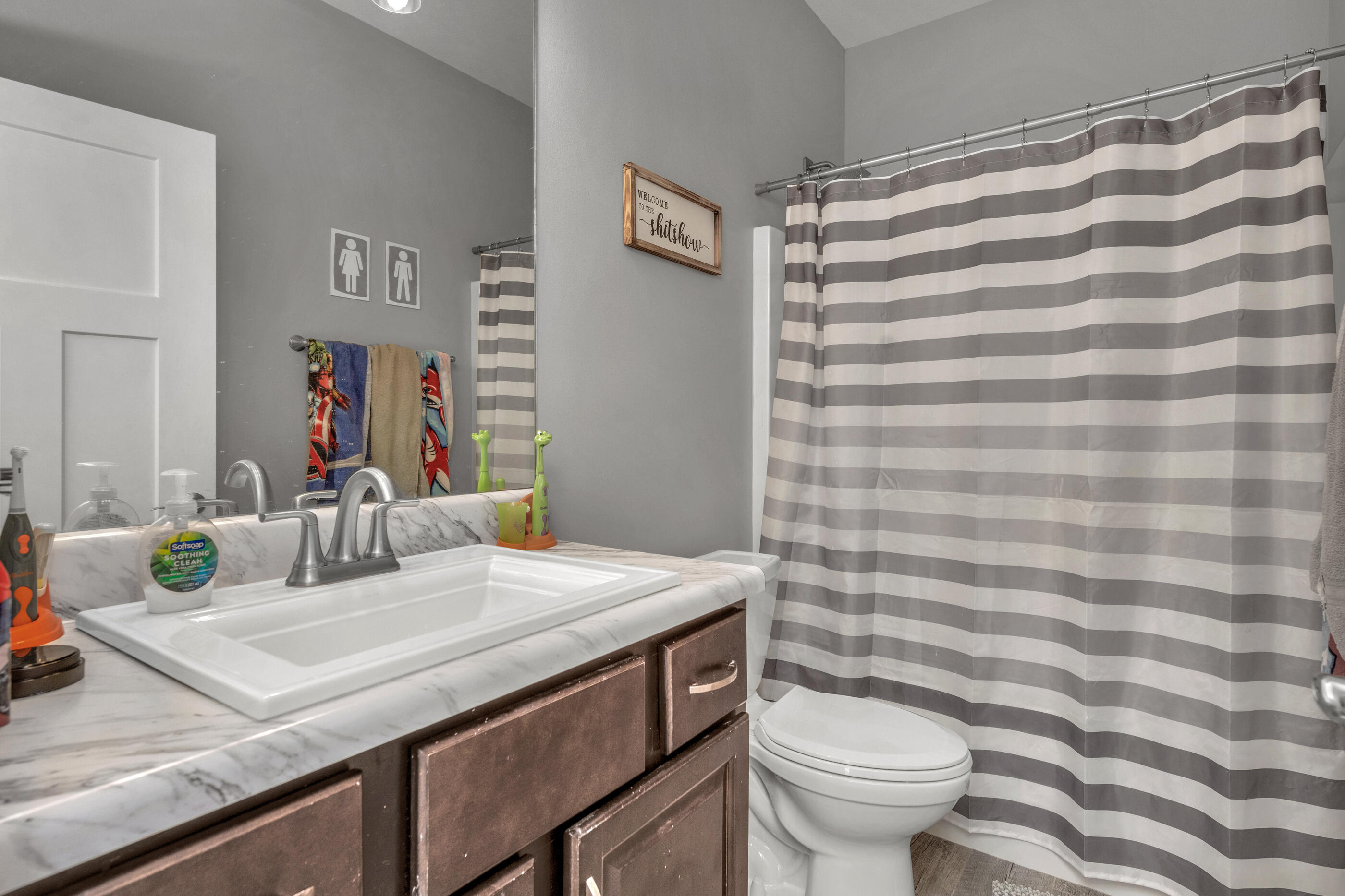 6116 Robin Road Crestview, FL 32539 - Photo 21 of 24 a bathroom with a sink and a mirror