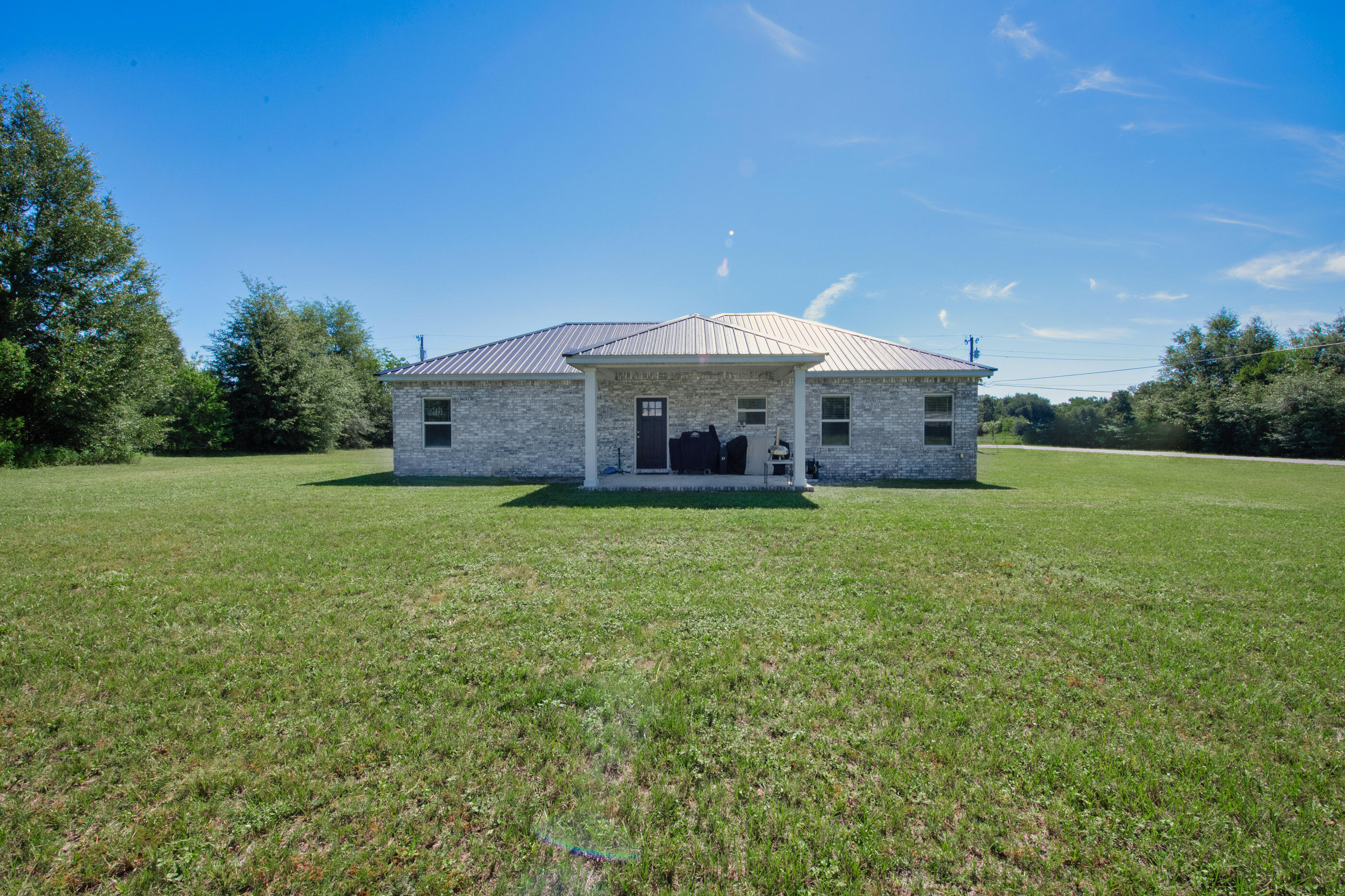 6116 Robin Road Crestview, FL 32539 - Photo 23 of 24 a front view of a house with garden
