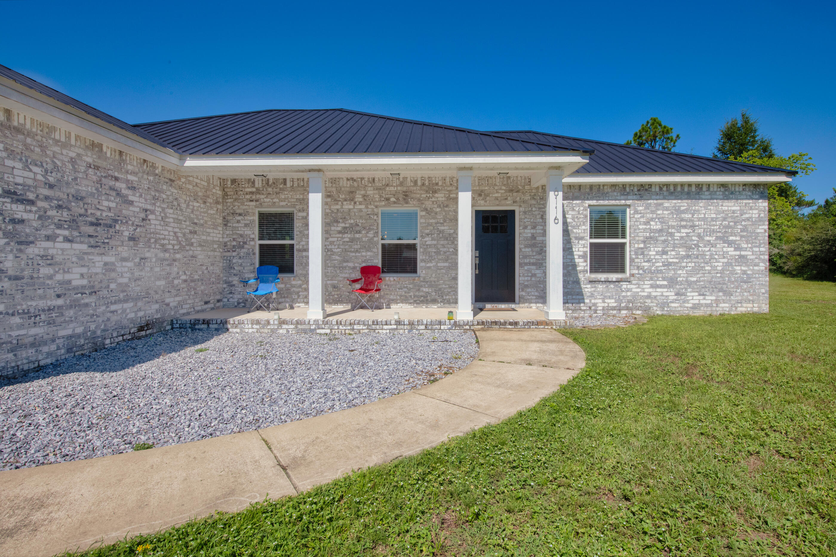 6116 Robin Road Crestview, FL 32539 - Photo 4 of 24 front view of a house with a yard