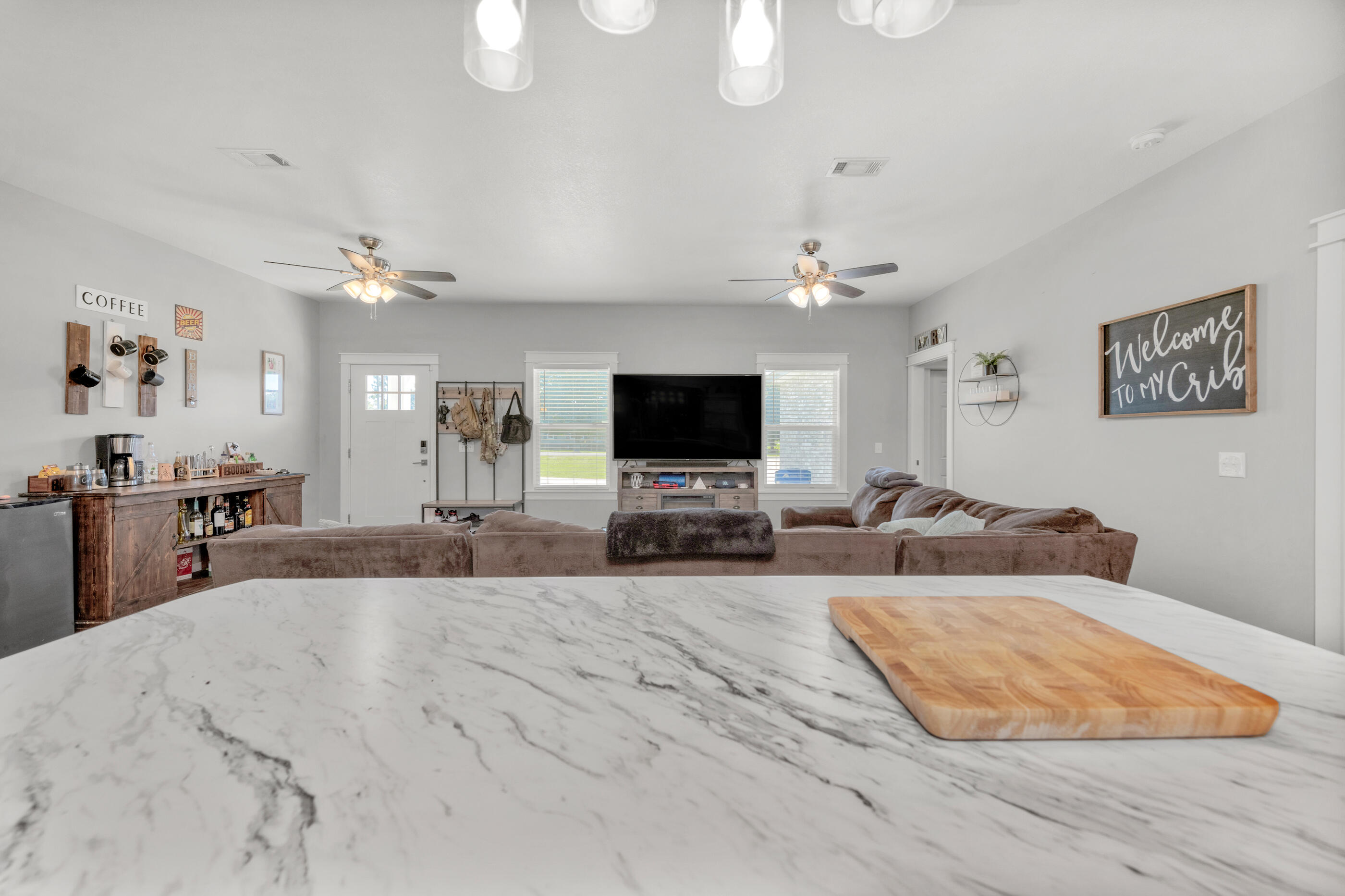 6116 Robin Road Crestview, FL 32539 - Photo 5 of 24 a living room with furniture and a flat screen tv