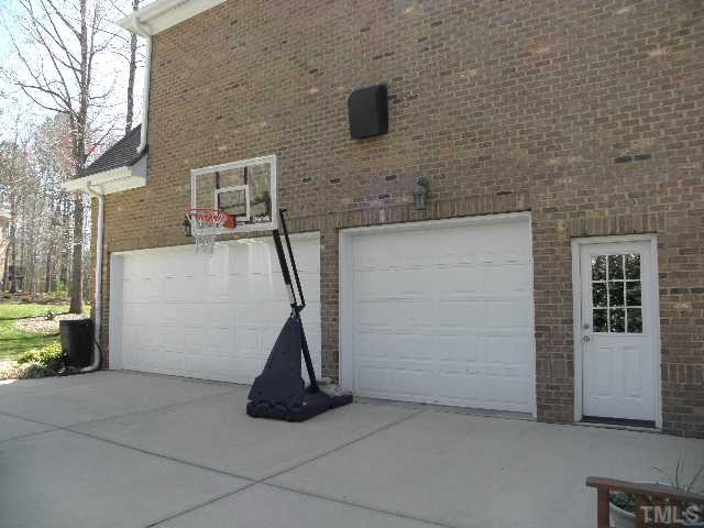 7009 Millstone Ridge Court Raleigh, NC 27614 - Photo 24 of 25 This nearly all brick home for sale in North Raleigh has a 3 car garage, a full basement and over an acre of land near falls lake and some of the areas best recreation destinations Parking Lot/Garage