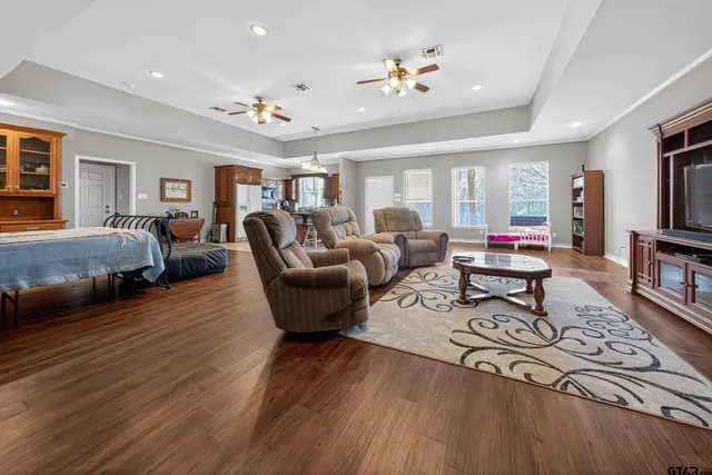 a living room with furniture fireplace and flat screen tv