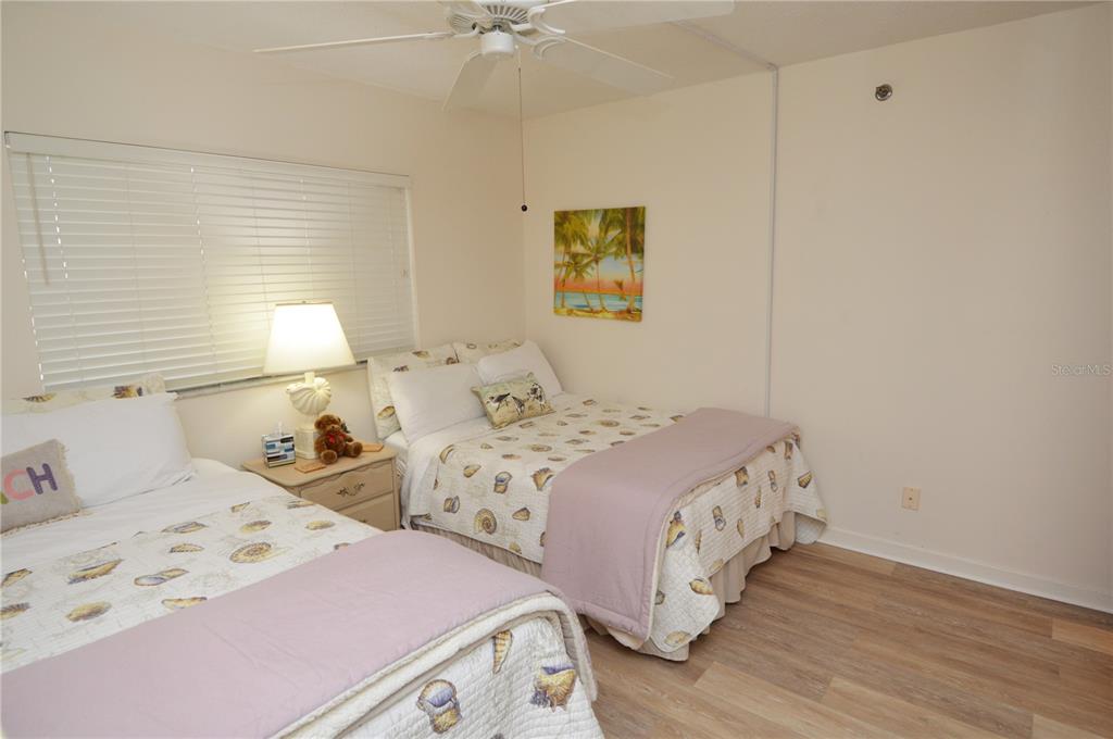 900 Gulf Boulevard, Unit 907 Indian Rocks Beach, FL 33785 - Photo 53 of 88 a bedroom with two beds and a window