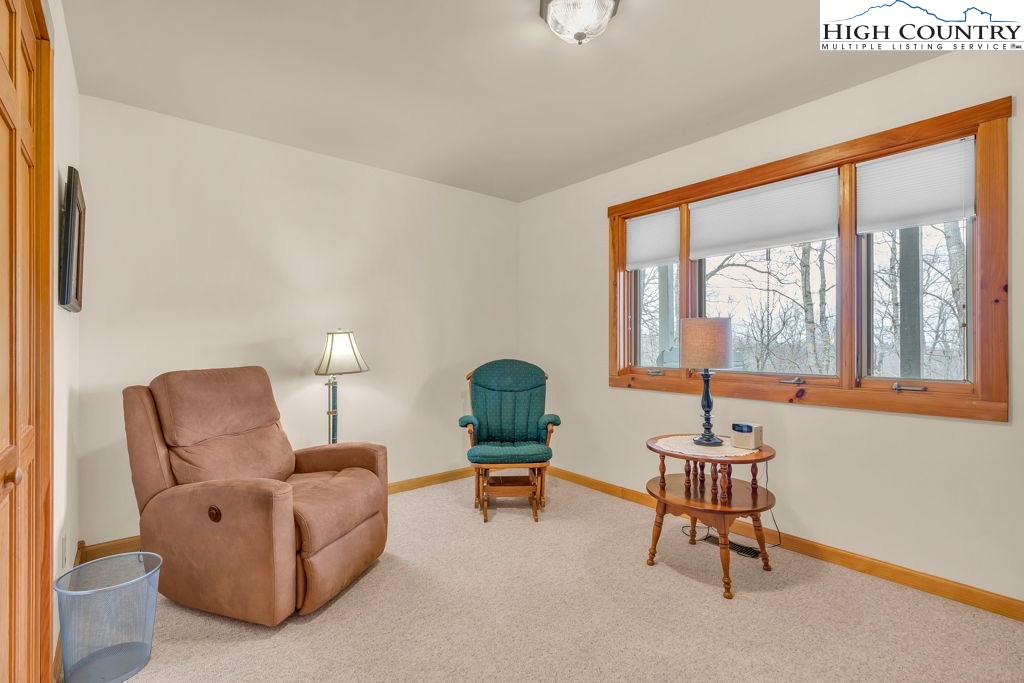 438 Virgil's Lane Boone, NC 28607 - Photo 16 of 32 a living room with furniture and a large window