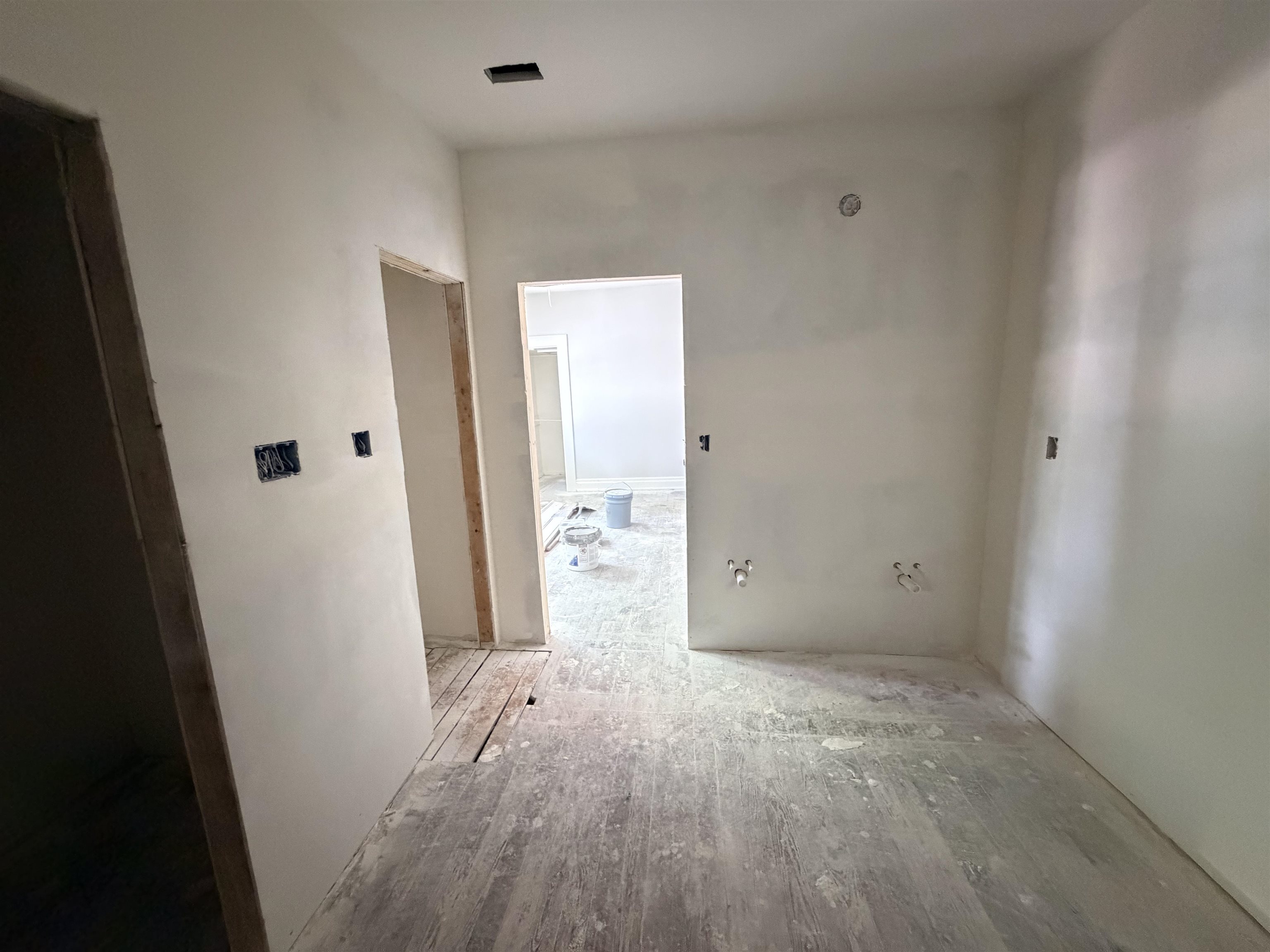 961 Meda Street Memphis, TN 38104 - Photo 15 of 27 Interior room with white walls, exposed wood-finish subfloor, and multiple electrical outlets