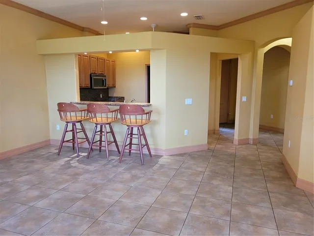 a view of a livingroom with furniture and a flat screen tv