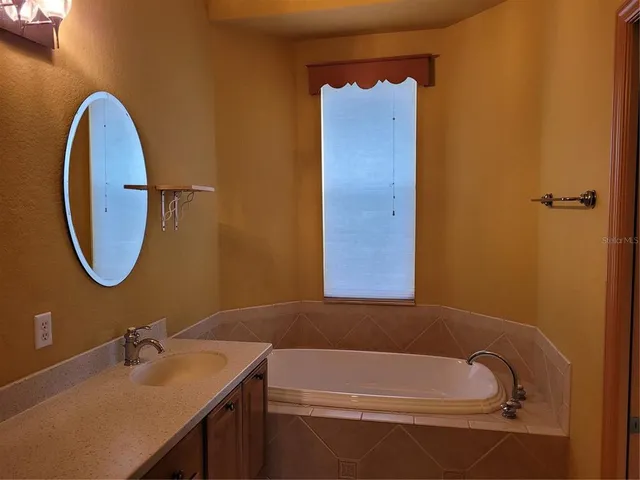 a bathroom with a sink and a bathtub